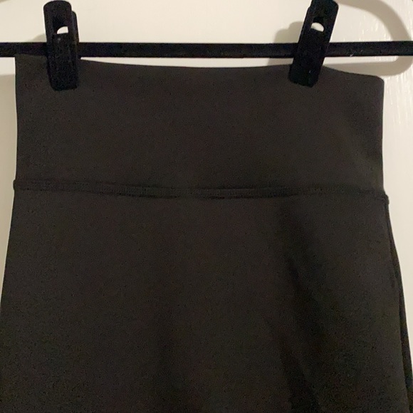 NWOT. Bebe black midi length skirt. Never worn. - Picture 2 of 6